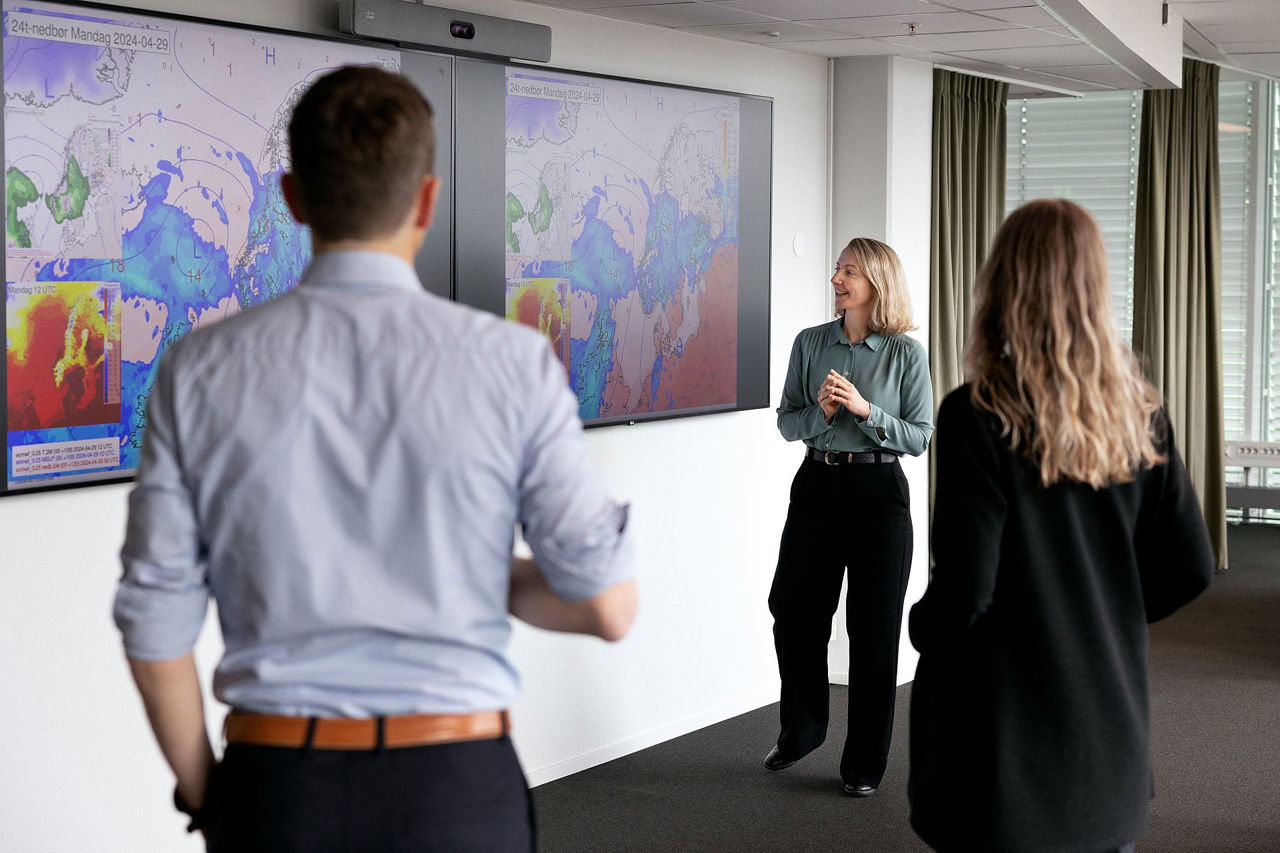 Trainee talking to group of people