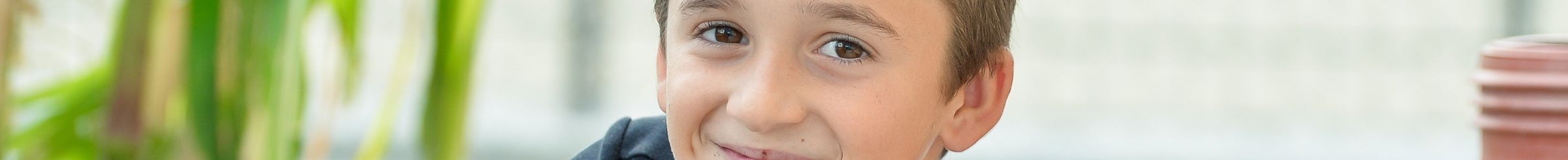 Boy sitting and smiling